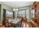 Dining area with chandelier lighting, natural light and seating for six at 2815 Mebane Ln, Durham, NC 27703