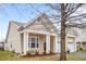 Charming single-story home with a welcoming front porch, neutral siding, and a convenient two-car garage at 2815 Mebane Ln, Durham, NC 27703
