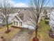Aerial front exterior view of home with two-car garage and landscaped yard at 2815 Mebane Ln, Durham, NC 27703