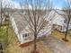 An aerial front exterior view of home with a two-car garage, lawn and trees at 2815 Mebane Ln, Durham, NC 27703