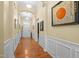 Elegant hallway boasts hardwood floors, wainscoting, and arched doorways at 2815 Mebane Ln, Durham, NC 27703
