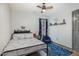 bedroom with hardwood floors, bright window, and playful decorations at 296 Trenburg Pl, Clayton, NC 27520
