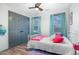 Cozy bedroom with hardwood floors, bright windows and playful decorations at 296 Trenburg Pl, Clayton, NC 27520