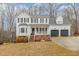 Charming two-story home with a welcoming front porch and well-manicured lawn at 296 Trenburg Pl, Clayton, NC 27520