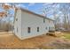 A spacious home featuring a well-maintained lawn, a welcoming deck, and beautiful landscaping, perfect for outdoor gatherings at 296 Trenburg Pl, Clayton, NC 27520