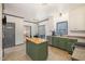 Well-lit kitchen with updated appliances, center island, and breakfast nook at 296 Trenburg Pl, Clayton, NC 27520