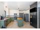 Spacious kitchen with stainless steel appliances, center island, and chalkboard accent wall at 296 Trenburg Pl, Clayton, NC 27520