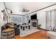 Cozy living room with a fireplace, large sofa, and natural light from the bay window at 296 Trenburg Pl, Clayton, NC 27520
