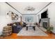 Bright and airy living room featuring a fireplace, plush sofa, and ample seating at 296 Trenburg Pl, Clayton, NC 27520