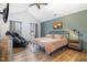 Vaulted main bedroom with a personal massage chair and rustic decor at 296 Trenburg Pl, Clayton, NC 27520