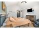 Vaulted main bedroom featuring a personal massage chair and mounted television at 296 Trenburg Pl, Clayton, NC 27520
