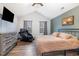 Vaulted main bedroom with a personal massage chair, natural light and rustic decor at 296 Trenburg Pl, Clayton, NC 27520