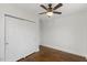 Bedroom featuring hardwood flooring, ceiling fan, and closet with white doors at 318 Fulton St, Burlington, NC 27217