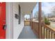 This is a charming covered porch with a red front door and a mailbox at 318 Fulton St, Burlington, NC 27217
