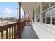 This is a charming covered porch with a mailbox and a view of the neighborhood at 318 Fulton St, Burlington, NC 27217