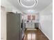 Bright kitchen featuring stainless steel appliances, white cabinetry and hardware at 318 Fulton St, Burlington, NC 27217