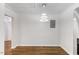 Kitchen featuring modern lighting fixture and open layout, stainless steel fridge at 318 Fulton St, Burlington, NC 27217