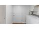 Bright laundry room with modern washer/dryer and convenient storage options at 318 Fulton St, Burlington, NC 27217