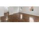 Spacious living room featuring hardwood floors, white walls, and abundant natural light at 318 Fulton St, Burlington, NC 27217