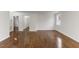 Spacious living room featuring hardwood floors, white walls, and abundant natural light at 318 Fulton St, Burlington, NC 27217