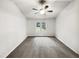 Empty bedroom featuring neutral walls, gray carpet, a ceiling fan, and a single window at 4205 Rockside Hills Dr, Raleigh, NC 27603