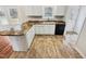 Bright kitchen featuring white cabinets, granite countertops, and stainless steel appliances at 4205 Rockside Hills Dr, Raleigh, NC 27603