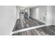 Open-concept layout connecting living area and kitchen, featuring modern flooring and neutral paint at 4213 Sunscape Ln, Raleigh, NC 27613