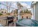 Outdoor deck with a hot tub, grill, heater, and open backyard view, perfect for relaxation and entertaining at 464 Granite Saddle Dr, Rolesville, NC 27571