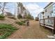 Spacious backyard with a fire pit and tiered landscaping, offering a serene outdoor setting at 464 Granite Saddle Dr, Rolesville, NC 27571