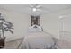 Well-lit bedroom featuring an elephant art piece and a cozy bed with decorative pillows at 464 Granite Saddle Dr, Rolesville, NC 27571