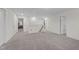 Neutral carpet spans this spacious upper living area with multiple doorways and natural light at 464 Granite Saddle Dr, Rolesville, NC 27571