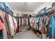 This walk-in closet features ample shelving and hanging space for storage at 464 Granite Saddle Dr, Rolesville, NC 27571