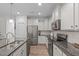 Bright kitchen featuring stainless steel appliances and granite counters at 464 Granite Saddle Dr, Rolesville, NC 27571