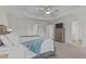 Spacious main bedroom suite offers tray ceiling, ceiling fan, and neutral color palette at 464 Granite Saddle Dr, Rolesville, NC 27571