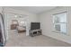 Main bedroom showcases a large opening to an ensuite, a TV, and windows at 464 Granite Saddle Dr, Rolesville, NC 27571