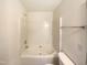 Bathroom featuring a large soaking tub with a showerhead and towel rack at 5107 Tomasita Ct, Raleigh, NC 27616