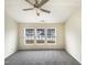 A bright main bedroom featuring three large windows looking out to the neighborhood at 5107 Tomasita Ct, Raleigh, NC 27616