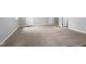 Spacious basement with neutral carpeting and multiple doorways, offering ample potential at 516 Caprice Ct, Raleigh, NC 27606