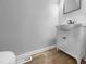 Powder room with stylish vanity, toilet, and contemporary fixtures at 516 Caprice Ct, Raleigh, NC 27606