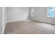 Bright bedroom featuring neutral carpet, gray walls and two sunny windows at 516 Caprice Ct, Raleigh, NC 27606