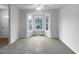 Bright room with a bay window, carpet flooring, and neutral decor at 516 Caprice Ct, Raleigh, NC 27606