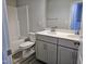 Bathroom with double sink vanity, toilet, and a tub with shower at 5849 Genesee Dr., Homesite 3, Durham, NC 27712