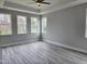 Bright bedroom with hardwood floors and windows at 5849 Genesee Dr., Homesite 3, Durham, NC 27712