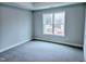 Bedroom with neutral walls, carpet and a window view at 5849 Genesee Dr., Homesite 3, Durham, NC 27712