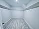 Walk-in closet with shelves and hardwood floors at 5849 Genesee Dr., Homesite 3, Durham, NC 27712
