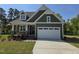 Charming one-story home with a two-car garage, covered porch and landscaped front yard at 5849 Genesee Dr., Homesite 3, Durham, NC 27712