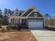 Charming one-story home with a two-car garage, covered porch and landscaped front yard at 5849 Genesee Dr., Homesite 3, Durham, NC 27712