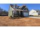 View of the left and front of a charming two-story home with a welcoming porch and freshly landscaped yard at 5849 Genesee Dr., Homesite 3, Durham, NC 27712