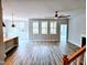 Bright living space with luxury vinyl plank flooring, a ceiling fan and lots of natural light at 5849 Genesee Dr., Homesite 3, Durham, NC 27712