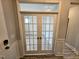 Bright office space with luxury vinyl plank flooring, french doors and lots of natural light at 5849 Genesee Dr., Homesite 3, Durham, NC 27712